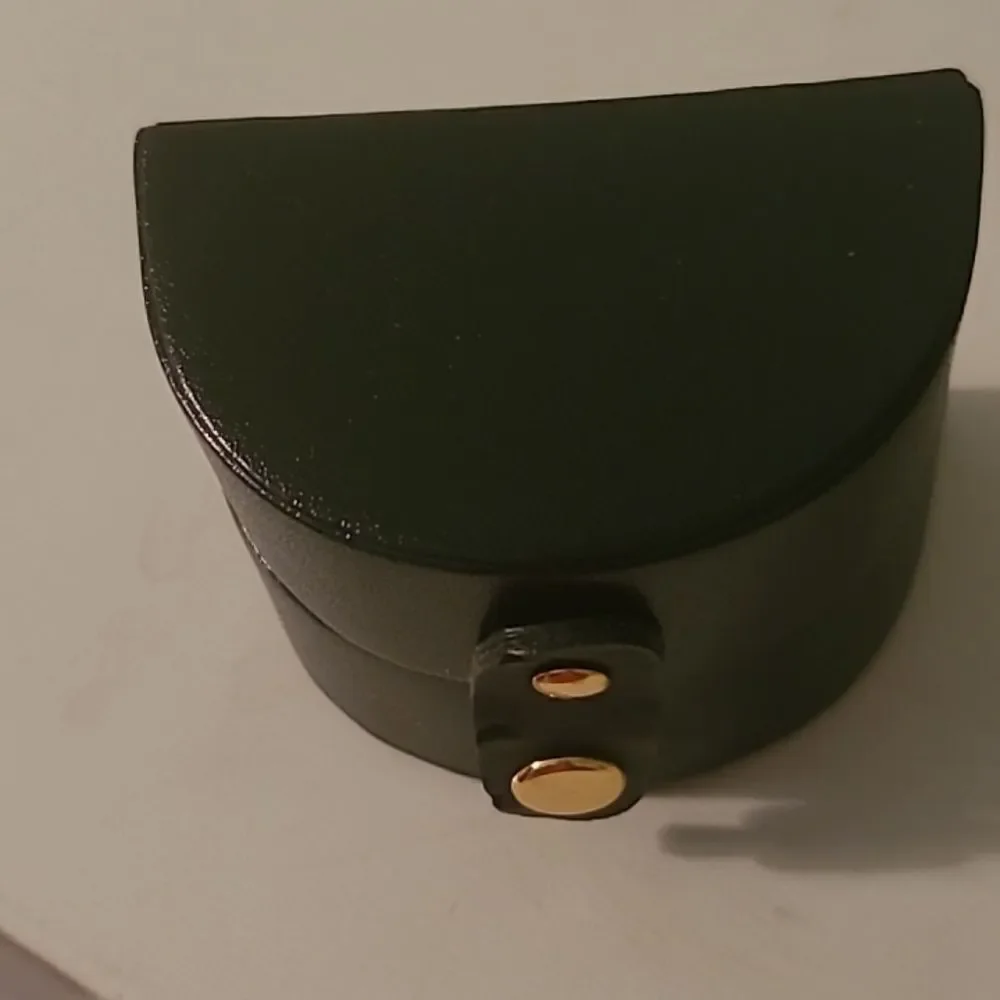 Black Oval Jewlry Case with Gold Accent
